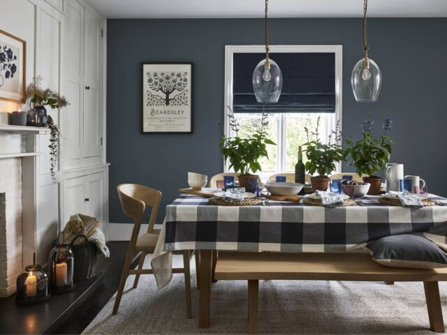 Dining room with grey-blue wall and dining table and bench by John Lewis