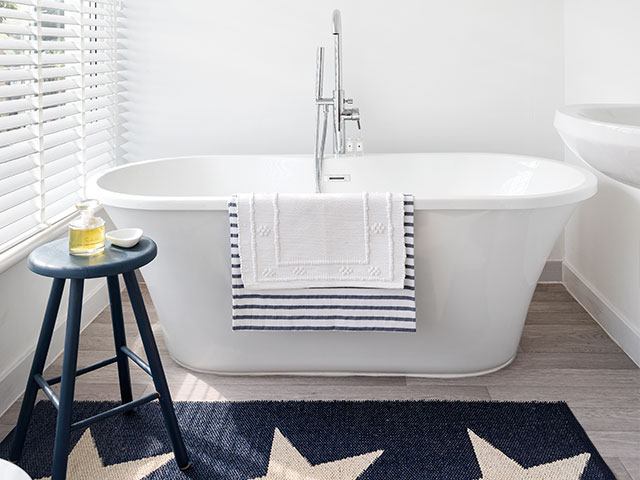A standalone tub is the focal point of the bathroom