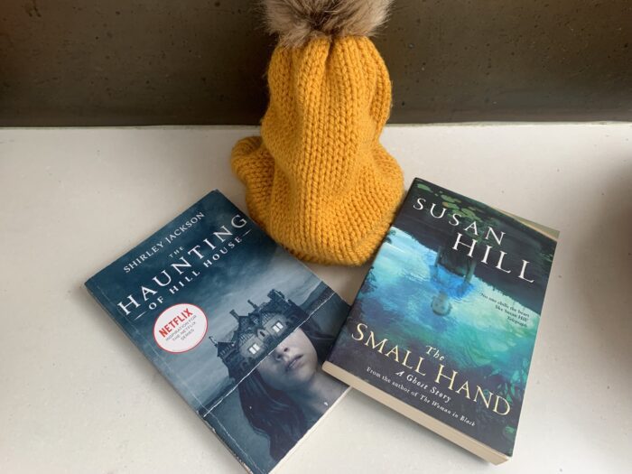 books and an orange hat