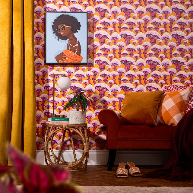 colourful home decor: orange and purple mushroom wallpaper in a retro-inspired home