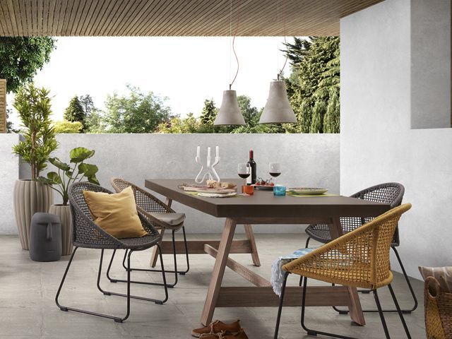 Cuckooland outdoor living space with wooden, natural furniture and shade from sun