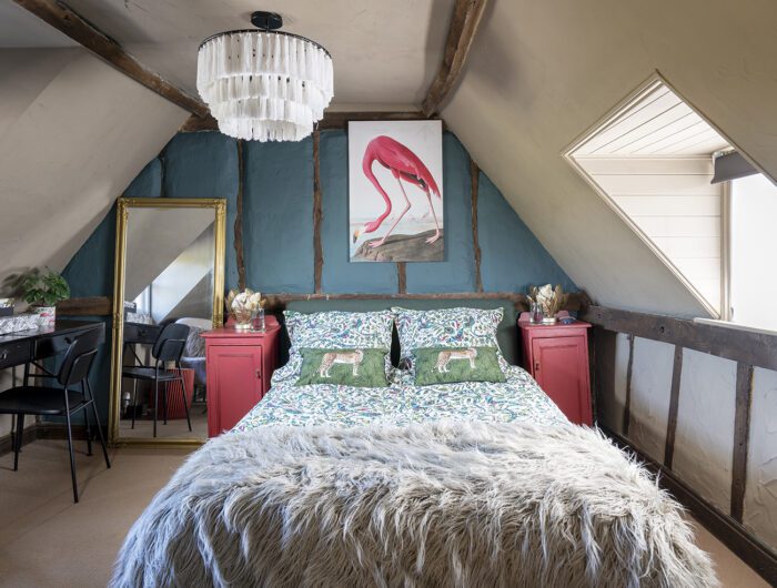 The two-tone scheme gives the main bedroom added interest, with walls in Farrow & Ball’s Mouse’s Back and Inchyra Blue. Upcycled side tables in Good Homes Fulham flat matt furniture paint by B&Q bring in a touch of red. ‘I’ve picked out the blue in the bedding, Emma J Shipley’s Jungle Palms, and the flamingo picture is from my own shop, Rebel and Ashby.’ 