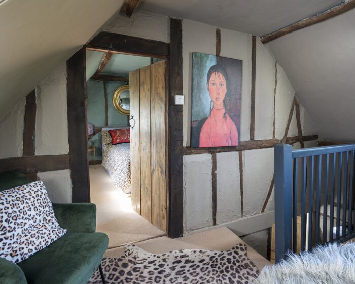 ‘I bought this picture of a girl from a flea market, and I just loved the simplicity of it. It shows up well against Farrow & Ball’s Mouse’s Back on the walls and I’ve added an Abigail Ahern Rya Faux Sheepskin chair and Hallan Lambswool cushion to bring in a mini seating area.’ 