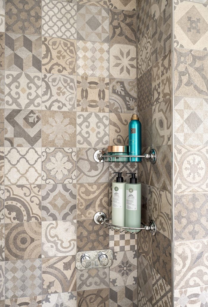 BUILD IT
Wanting a seat in the shower, Hayley and Darren built their own from a special kit and then tiled it in sheeted mosaics as the tiles are able to bend round the frame.