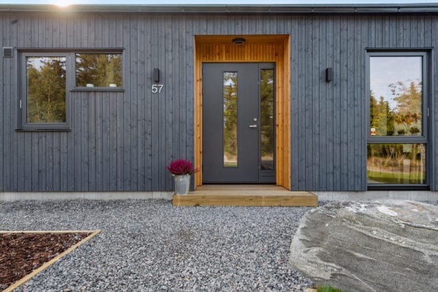 front of timber house painted grey