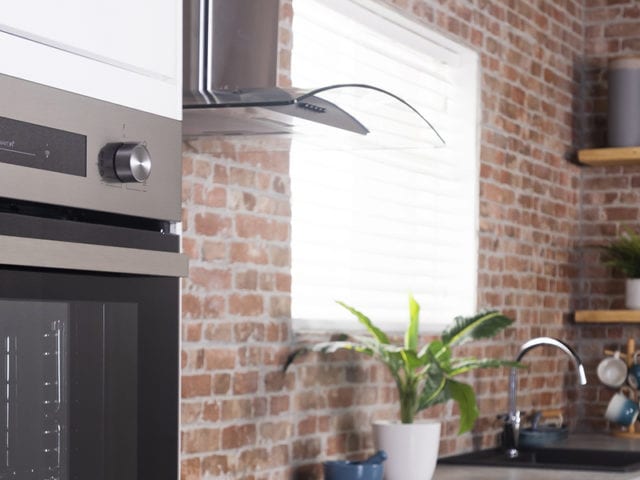 E Black Built-in Electric Single Oven in brickwork kitchen