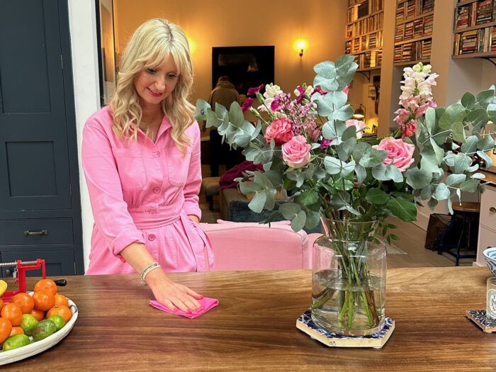 Lynsey Crombie Queen of Clean wiping down worktop