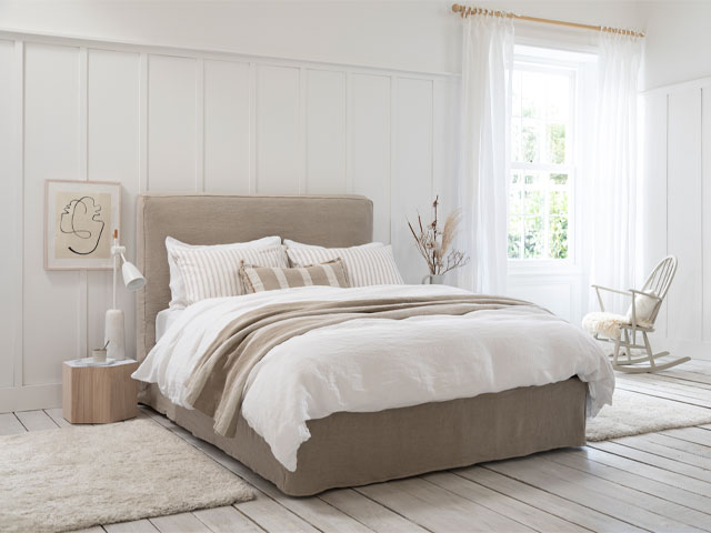neutral home decor: bedroom dressed in off-whites, caramel and linen shades