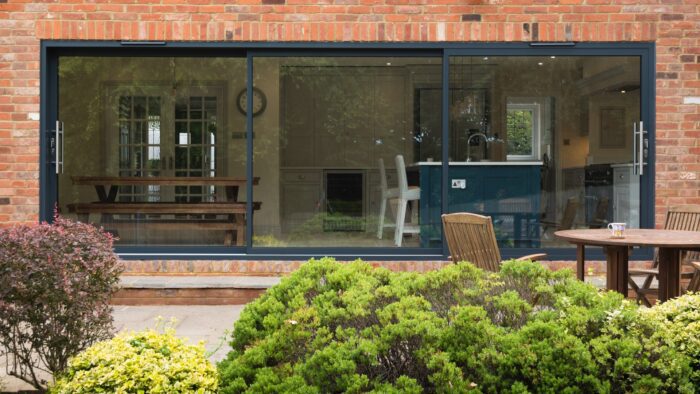 Set of three aluminium sliding doors close from exterior