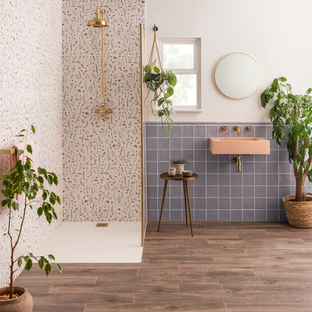 Nature inspired bathroom with tiled walls and foliage
