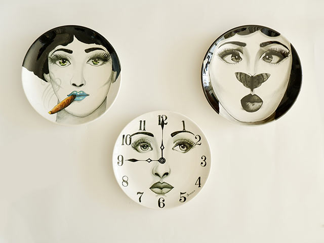 Female empowerment plates on white wall