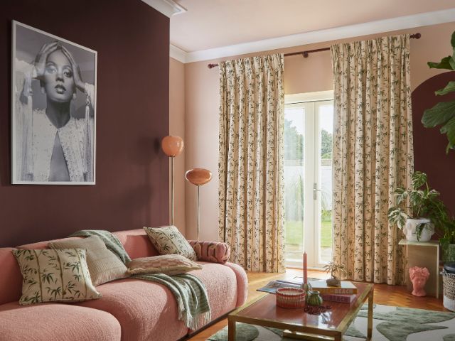 80s inspired living rom with patterned curtains