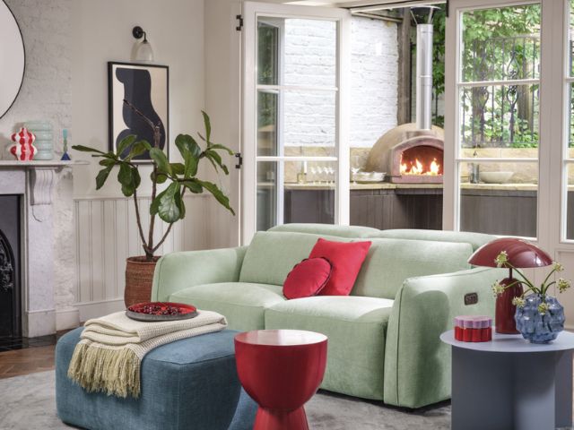 Mint green sofa in a living room by Sofology