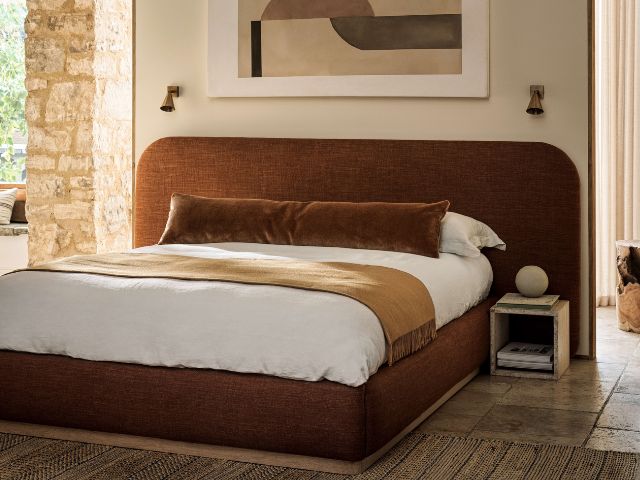 Curved bed in a 70s inspired bedroom