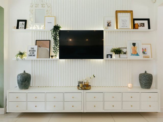 TV on the wall with shelving