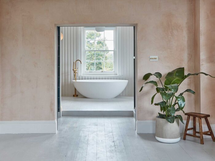 Plaster has a similar look to limewash walls but a warmer colour